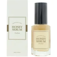 "I'm FROM Honey Serum 30ml in a clear bottle with black cap, beige label, next to matching box."