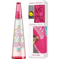 Transparent conical bottle with pink cap, colorful text design, next to a pink and white decorative box.