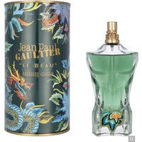 Green torso-shaped bottle with gold cap, next to floral-patterned cylindrical box, "Jean Paul Gaultier Le Beau" text.