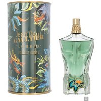 Green torso-shaped perfume bottle with gold cap, floral design, next to a colorful cylindrical box.