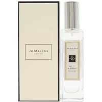 Clear glass bottle with silver cap, Jo Malone London Poppy & Barley Eau De Cologne label, next to cream box.