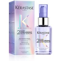 Kérastase Blond Absolu serum in a purple bottle with dropper, next to iridescent box.