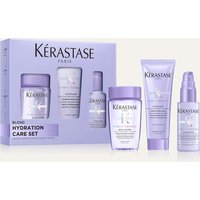 Kérastase Blond Absolu gift set with purple shampoo, conditioner, and serum in lavender packaging.