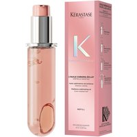 Kérastase Chroma Absolu Hair Oil in clear pink capsule with silver pump, next to matching pink box.