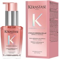 Pink Kérastase Chroma Hair Oil bottle with silver pump, next to matching pink box with holographic text.