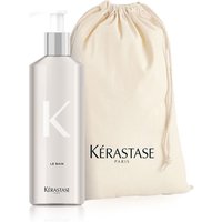 Kérastase Nutritive Bain Satin 2 in silver refillable aluminum bottle with pump, alongside beige drawstring bag.