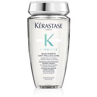 Clear bottle of Kérastase Symbiose Purifying Anti-Dandruff Shampoo with silver cap and teal accents.