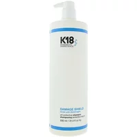 K18 Damage Shield pH Protective Shampoo 930ml, white bottle with blue accents and pump dispenser.