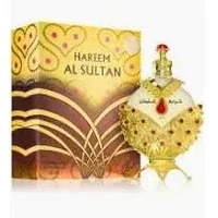 Khadlaj Hareem Al Sultan Gold perfume oil, ornate gold bottle with red gem, matching decorative box.