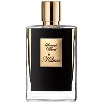 Clear glass bottle with black label, gold cap, and gold plaque reading "Sacred Wood by Kilian," unisex woody perfume.