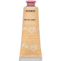 Korres Mountain Honey Hand Cream in a peach tube with white heart and floral designs, pink cap.