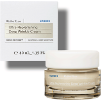 Korres White Pine cream in a clear jar with white lid, next to a white box with product details.