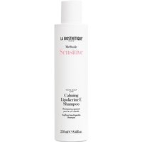 White cylindrical bottle of La Biosthetique Calming Lipokerine E Shampoo with black text and pink accents, 250ml.
