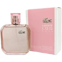 Pink Lacoste L.12.12 Rose Eau De Toilette bottle with textured surface and matching box.