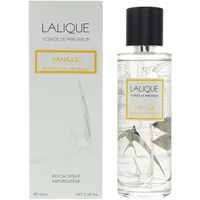 Clear glass bottle with gold label, Lalique Vanille Acapulco Room Spray 100ml, next to matching white box.