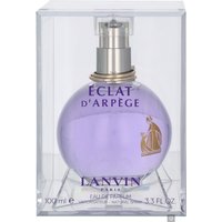 Purple spherical Lanvin Eclat D'Arpege perfume bottle with silver cap in a clear rectangular case.
