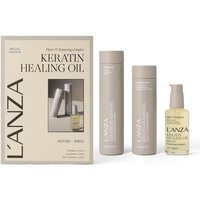 L'Anza Keratin Healing Oil Gift Set with beige shampoo, conditioner bottles, and pump bottle, in branded box.