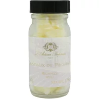 Clear jar with black lid containing yellow scented crystals, labeled "L'Artisan Parfumeur Cristaux De Provence 50g Refill."