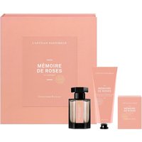 Pink L'Artisan Parfumeur gift set with EDP spray, hand cream, and soap in elegant packaging.