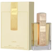 Lattafa Angham Eau De Parfum 100ml, gold-accented bottle with embossed cap, next to matching cream box.