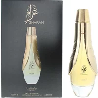 Gold and clear Lattafa Pride Gharam Eau De Parfum 100ml bottle with black box featuring Arabic script.