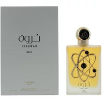 Lattafa Tharwah Gold Eau De Parfum 100ml, gold bottle with black atom design, silver cap, gray box with Arabic text.