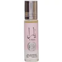 Clear glass bottle of Lattafa Yara Eau De Parfum 10ml with silver cap and pink label featuring Arabic script.