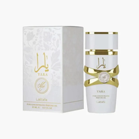 White and gold Lattafa Yara Moi perfume oil bottle with floral design, 20ml, next to matching box.