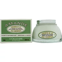 L'Occitane Almond Milk Concentrate in a clear jar with a green label, next to a matching green box.