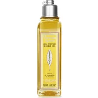 Clear rectangular bottle of L'Occitane Verbena Shower Gel with silver cap and yellow liquid, featuring leaf design label.