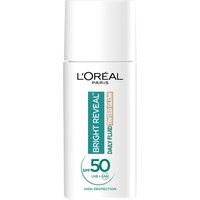 White L'Oreal Paris Bright Reveal SPF 50+ bottle with teal and silver label, featuring niacinamide for dark spot correction.