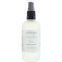 Clear bottle of Made By Coopers Manuka Aloe Soothing Face Mist with black spray nozzle and white label.