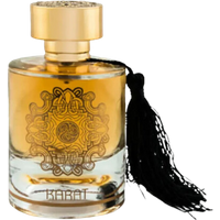 Maison Alhambra Karat Eau De Parfum, 100 ml, in a clear bottle with gold cap and ornate black tassel.