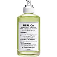 Maison Margiela unisex fougère perfume in clear bottle with silver spray nozzle, green liquid, and white label.