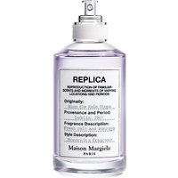 Clear glass bottle of Maison Margiela women's marine perfume with silver spray nozzle and white label.