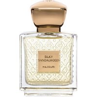 Clear glass bottle of Majouri Silky Sandalwood perfume, gold cap, embossed geometric pattern, 75 ml.