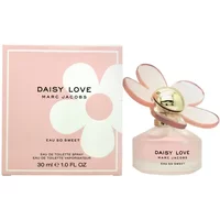 Pink Marc Jacobs Daisy Love Eau So Sweet perfume bottle with flower-shaped cap, next to matching box.