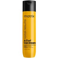Yellow Matrix shampoo bottle with black cap, labeled "A Curl Can Dream" and infused with Manuka honey.
