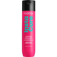 Pink Matrix Total Results InstaCure Anti-Breakage Shampoo bottle with black cap and teal text.