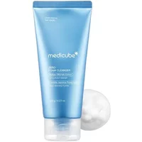 Medicube Zero Foam Cleanser 120g in a blue tube with white text, next to a dollop of white foam.