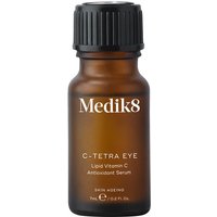 Amber bottle of Medik8 C Tetra Eye Serum with black ribbed cap and white text detailing.
