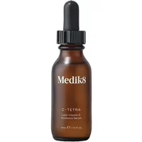 Brown glass bottle with black dropper cap, labeled "Medik8 C-Tetra Lipid Vitamin C Antioxidant Serum 30ml."