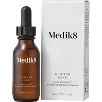 Brown glass bottle with black dropper, labeled "Medik8 C-Tetra Luxe," next to a white box with product details.