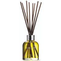 Clear glass diffuser with yellow liquid, silver cap, and dark reeds, labeled "Molton Brown Coastal Cypress & Sea Fennel."