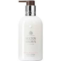White Molton Brown body lotion bottle with pump, silver logo, and pink "Delicious Rhubarb & Rose" label.