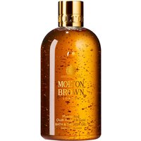 Amber bottle of Molton Brown Oudh Accord & Gold Bath & Shower Gel with gold cap and floating gold flecks.
