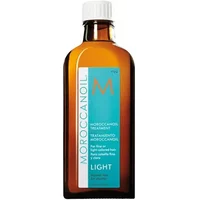 Amber glass bottle of Moroccanoil Treatment Light with white cap and turquoise label featuring orange logo and text.