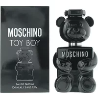 Black teddy bear-shaped Moschino Toy Boy Eau De Parfum bottle next to matching box, 100ml size.