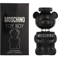 Black teddy bear-shaped Moschino Toy Boy Eau de Parfum bottle next to matching box, 30ml size.