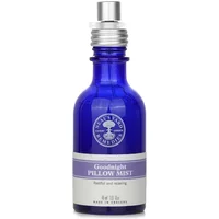 Blue glass bottle of Neal's Yard Remedies Goodnight Pillow Mist with silver spray cap and lavender label, 45ml.